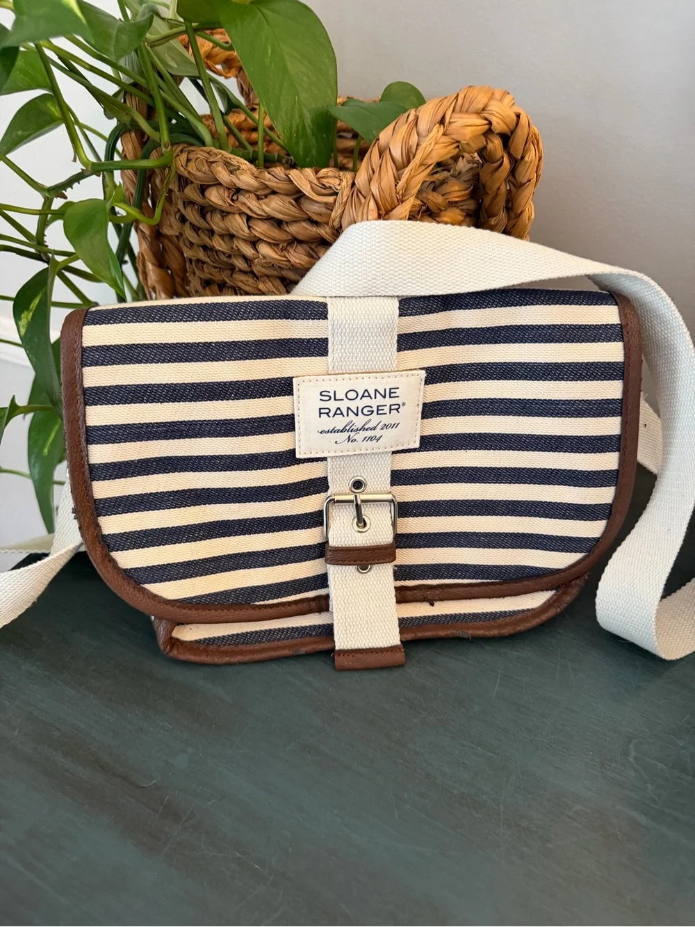 Sloan Ranger striped canvas saddle bag with brown leather trim and buckled